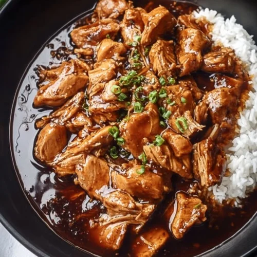 Delicious plate of Bourbon Chicken glazed with sweet and tangy sauce