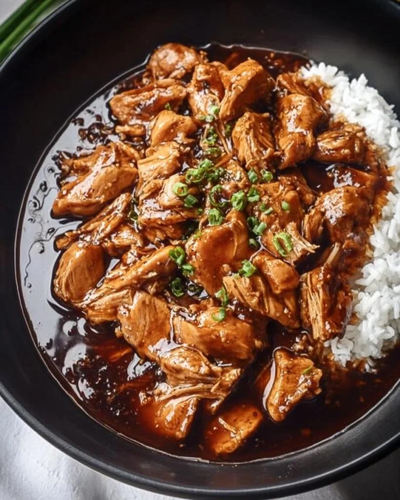 Delicious plate of Bourbon Chicken glazed with sweet and tangy sauce