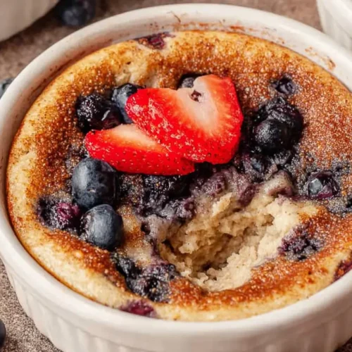Delicious baked protein pancake bowls topped with fresh fruit