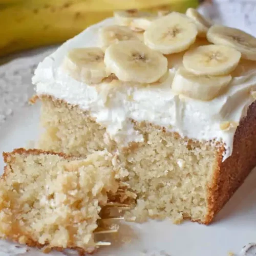 A perfectly baked best banana cake with a creamy frosting.
