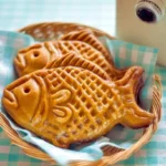 Colorful fish-shaped cake, perfect for a child's birthday party.