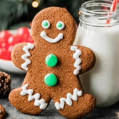 A collection of festive gingerbread cookies decorated with white icing.