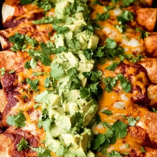 Sweet potato, corn, and black bean enchiladas plated and ready to serve
