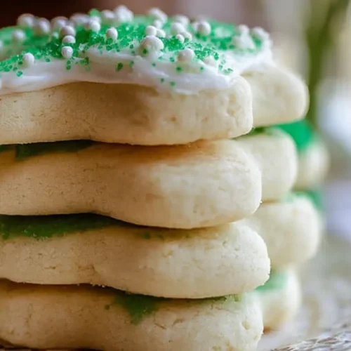 A close-up of a stack of the best soft sugar cookies, perfectly baked and unadorned.