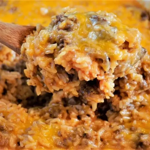 A bubbling cheesy hamburger rice casserole, fresh from the oven