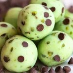 Several homemade Andes Mint Chocolate Truffles arranged artfully on a serving dish.