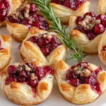 Various cranberry brie bites arranged on a serving platter