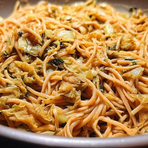 A serving of creamy caramelized cabbage pasta in a bowl.