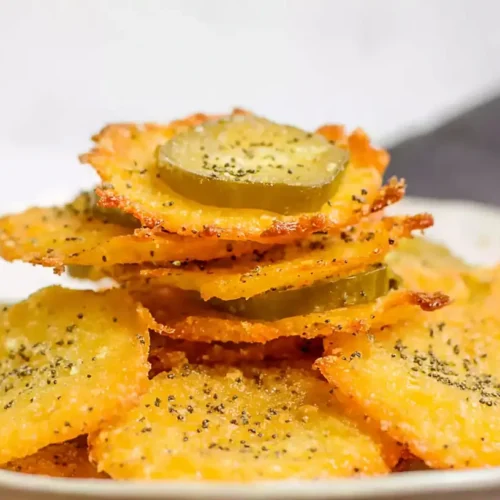 Golden brown crispy pickle cheese bites on a serving platter