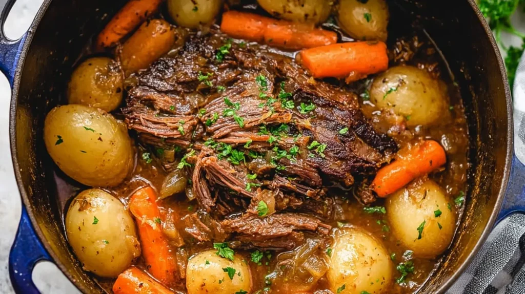 A savory pot roast cooking in a heavy Dutch oven