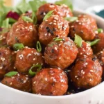 Delicious slow cooker honey garlic meatballs simmering in a rich, shiny sauce, ready to serve.