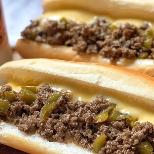 A close-up of delicious ground beef Philly cheesesteaks, ready to serve.