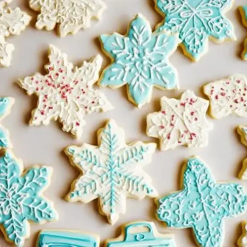 A close-up view of beautifully decorated iced sugar cookies with colorful frosting.