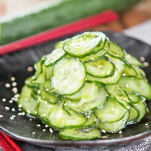 A refreshing Japanese cucumber salad, known as Sunomono, in a bowl.