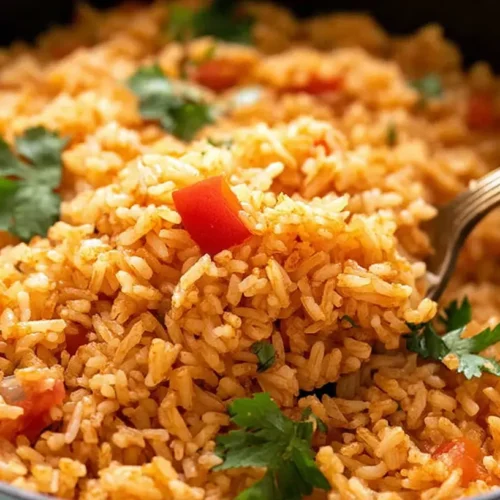 A serving of savory Mexican rice with vegetables.