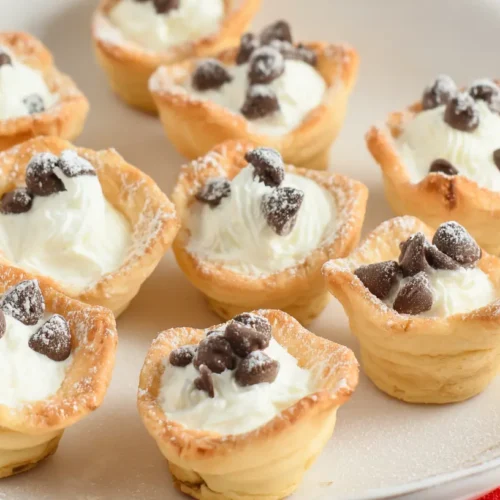 A selection of mini cannoli cups filled with creamy goodness
