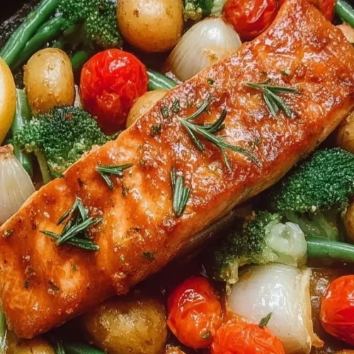 A savory one pan maple salmon with roasted vegetables displayed artfully.