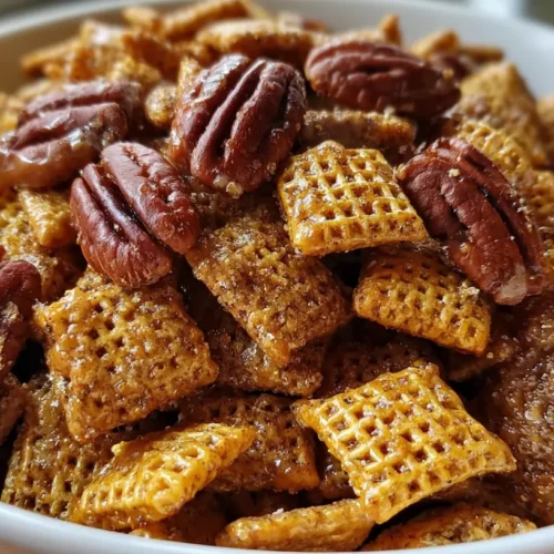 A close-up of delicious praline crunch with nuts and caramel.