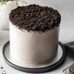 Rich chocolate Oreo cake showcasing its layers and cookie pieces.