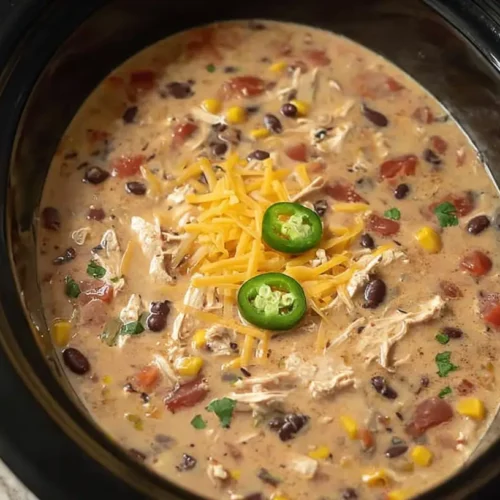 A vibrant slow cooker fiesta chicken soup, ready to serve