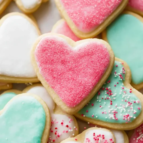 A plate of soft cutout sugar cookies ready for decorating.
