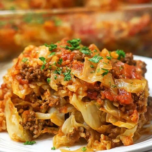 A large casserole dish filled with baked stuffed cabbage roll casserole