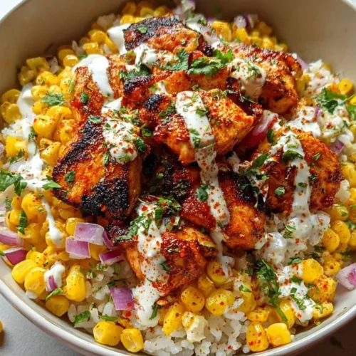 A delicious street corn chicken bowl topped with fresh ingredients.