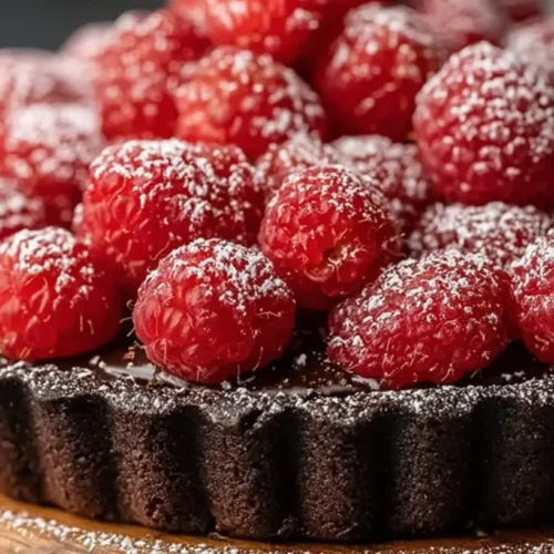 An easy chocolate raspberry tart with fresh berries on top