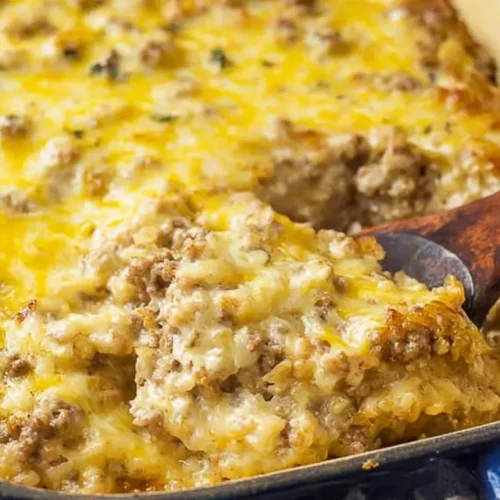 A bubbling cheesy ground beef casserole fresh from the oven, topped with golden cheese.