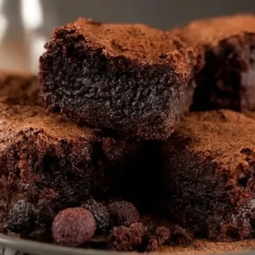 A rich chocolate brownie dessert, warm and fudgy, presented beautifully.