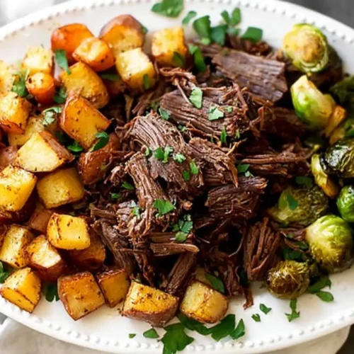 A slow-cooked crockpot Whole30 beef roast with vegetables