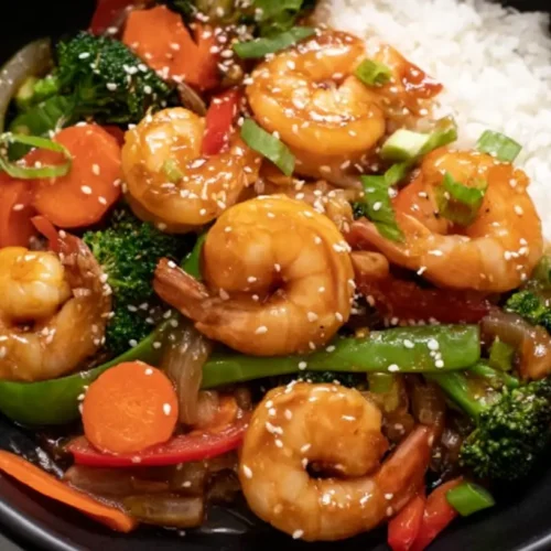 A vibrant simple shrimp stir-fry dinner with mixed vegetables and noodles.