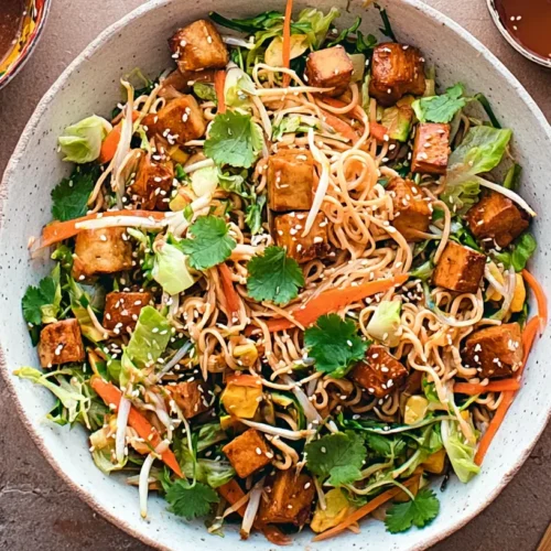 A refreshing tofu veggie noodle salad with sesame dressing, perfect for dinner.