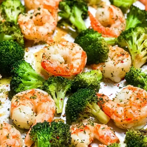A well-portioned and balanced shrimp dinner with vegetables and grains on a white plate.