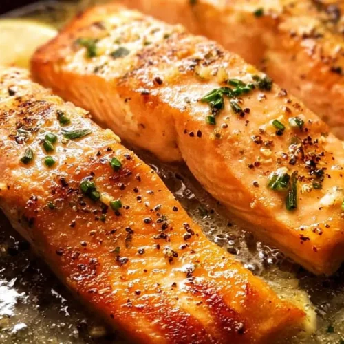 Cooked Easy Garlic Butter Salmon fillet on a pan, golden brown