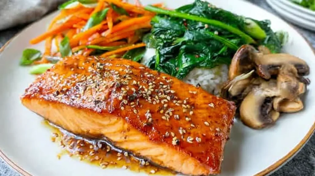Healthy balanced salmon dinner on a white plate, ready to be served.