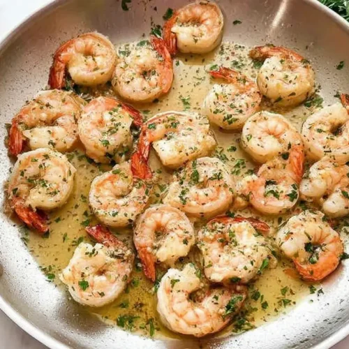 A plate of quick butter garlic shrimp perfectly cooked and seasoned.