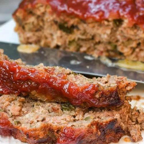 A full serving of retro meatloaf dinner with gravy and mashed potatoes