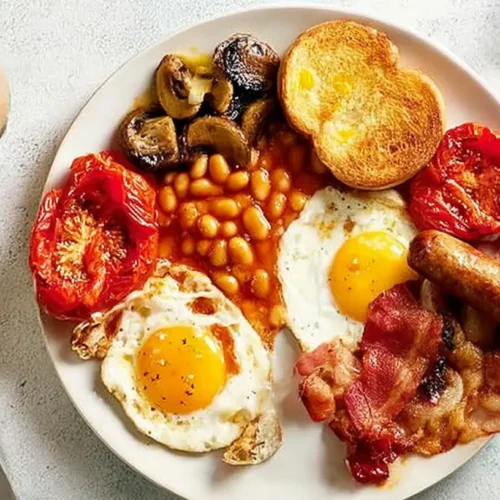 A variety of classic breakfast plate ideas with eggs, bacon, and toast