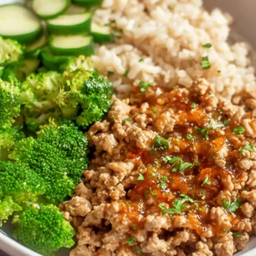 A healthy light ground turkey dinner served with fresh vegetables.