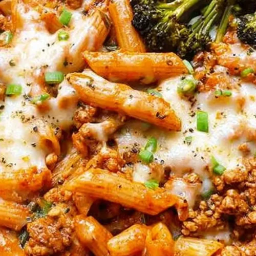 A light ground turkey dinner plate with vegetables and rice.