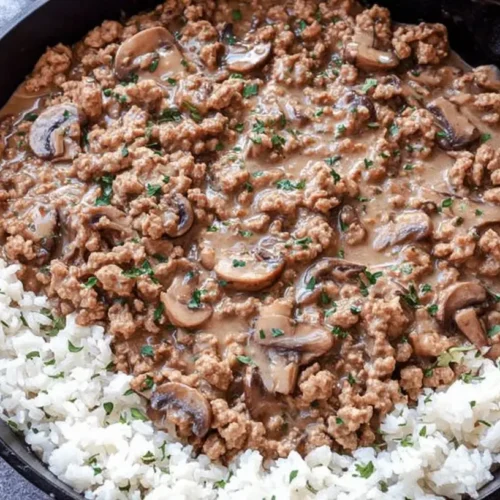 A serving of lightened-up ground turkey meal in a bowl, showing lean meat and vegetables.