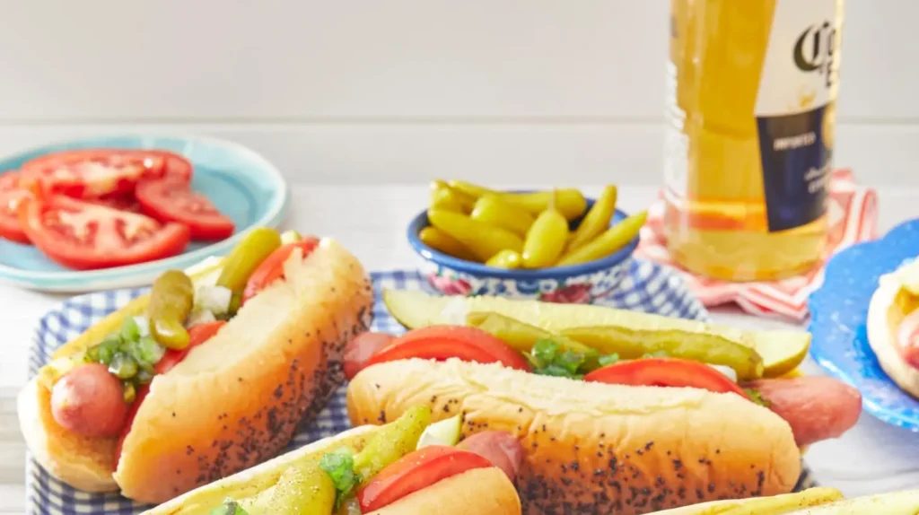 An authentic Chicago style hot dog with all the traditional toppings on a poppy seed bun.