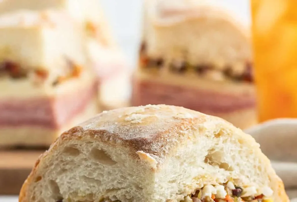 A New Orleans muffuletta sandwich with olive salad and various meats
