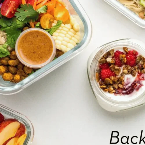 Various containers of back to school meal prep ideas laid out on a kitchen counter