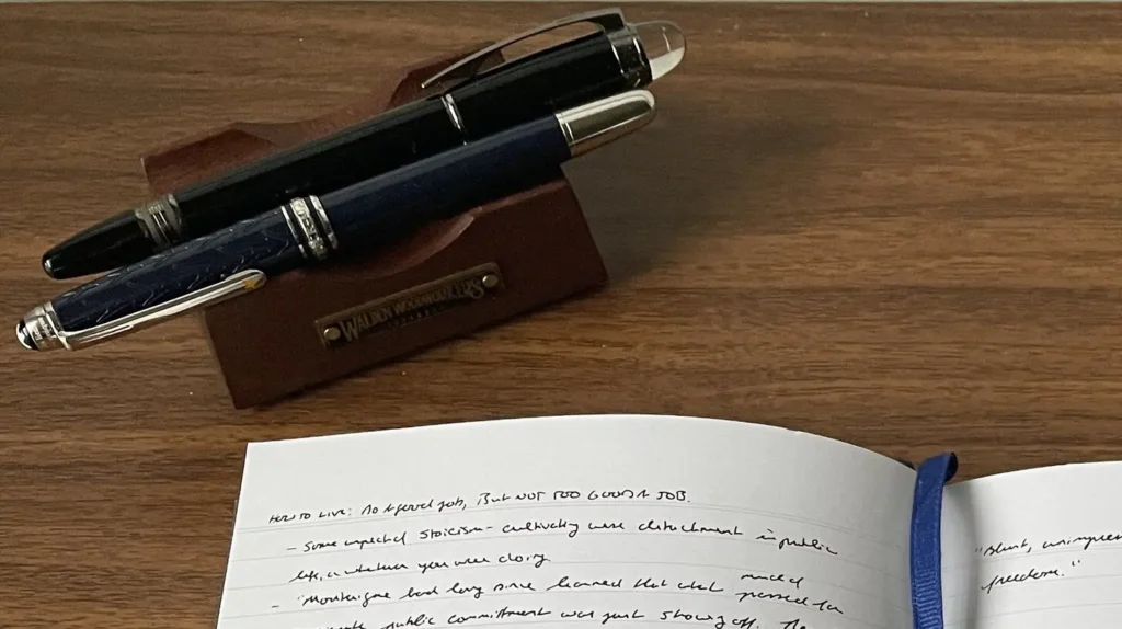 Stack of various notebooks for note taking on a desk