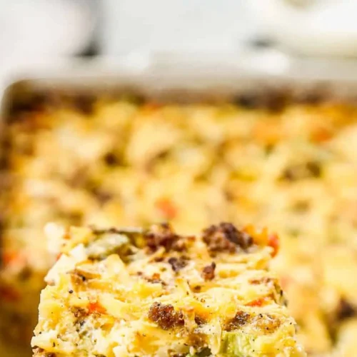 A golden brown breakfast casserole featuring hash browns and melted cheese