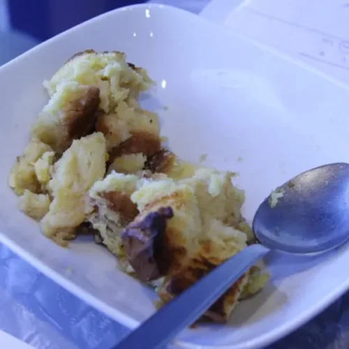 A hot and delicious cheesy breakfast casserole, freshly baked and golden brown.