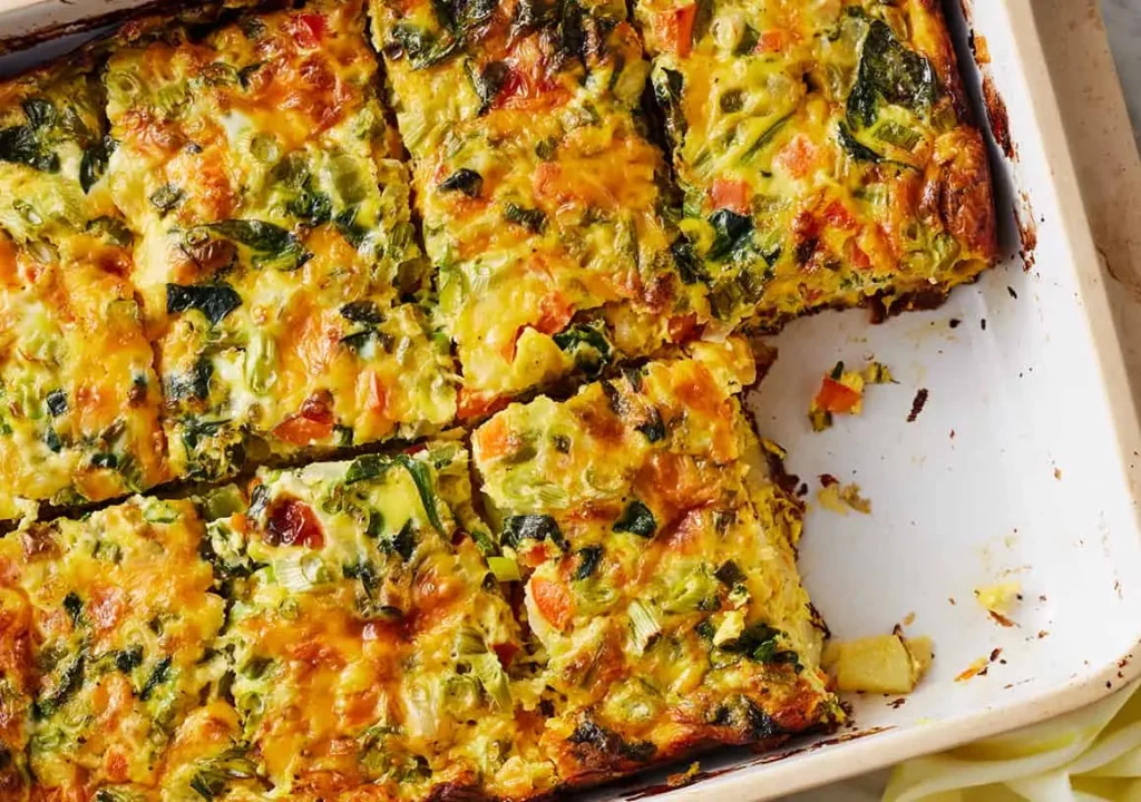 A baked effortless breakfast casserole dish with eggs, cheese, and sausage