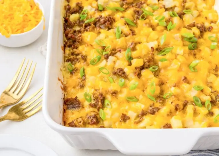 A baked Family Favorite Make Ahead Breakfast Casserole in a dish, ready to serve.